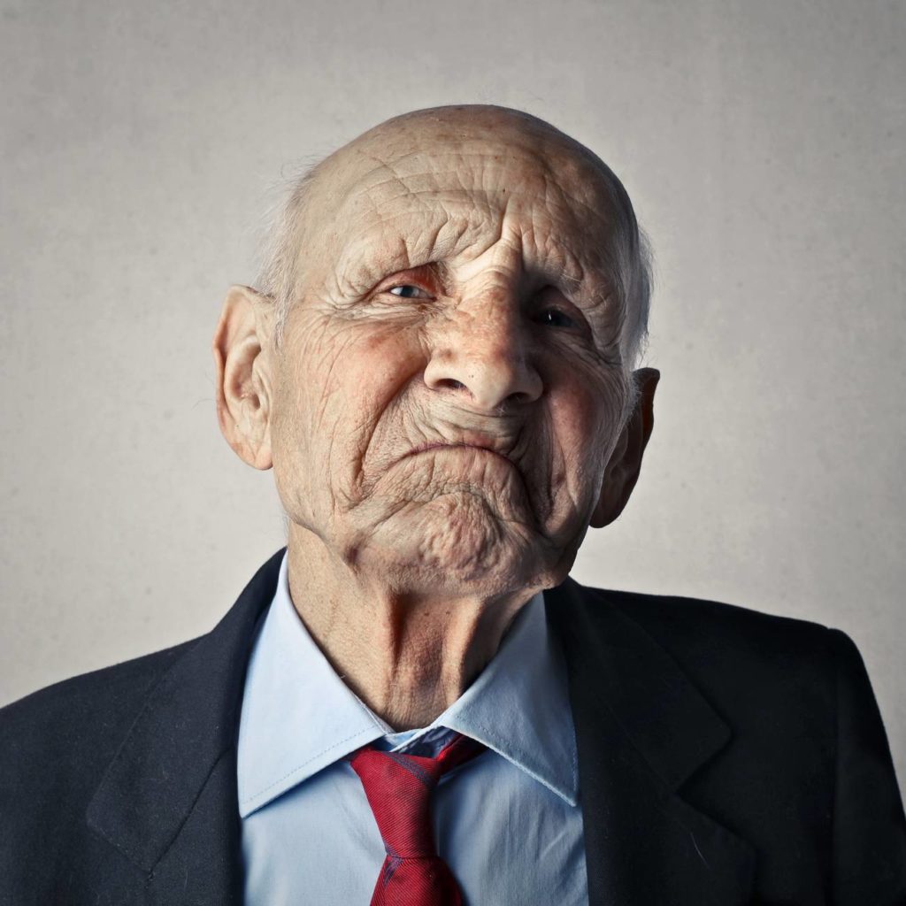 portrait photo of man in black formal coat